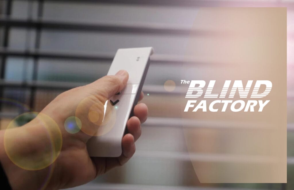 A smart blind with remote control, featuring sleek, modern design and automated functionality for convenient light and privacy management. The remote allows for easy adjustment from anywhere in the room, enhancing both comfort and energy efficiency in the home.