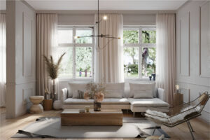 Modern living room with large windows, light-colored curtains, a minimalist sectional sofa, and natural decor elements.
