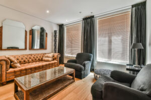 Modern window treatment with a black fabric side blind and a sleek roller blind, enhancing the interior design with a stylish and functional light control solution.