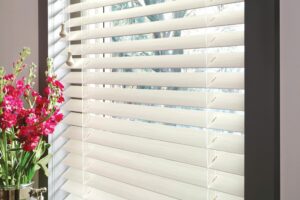 Closeup of window blinds with decorative flower