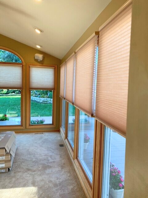 Cellular shades installed on floor to ceiling home windows.