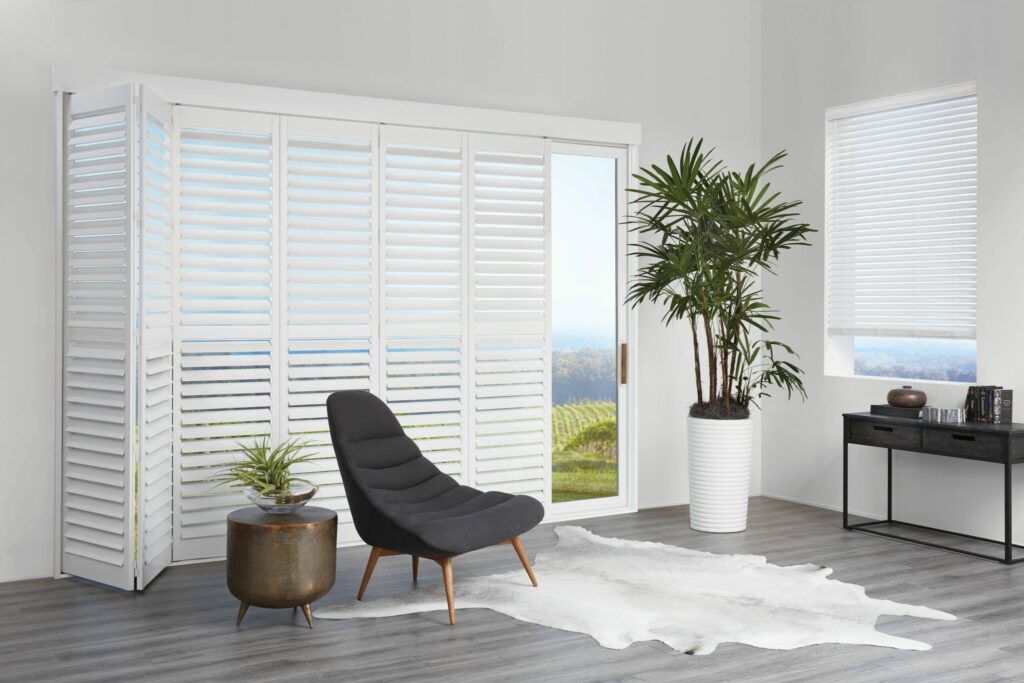 Wooden interior shutters covering windows in modern home.